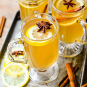 Close up overhead of the finished hot toddy cocktails in glass mugs.