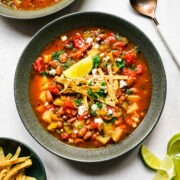 Overhead view of the finished pinto bean soup topped with tortilla strips.