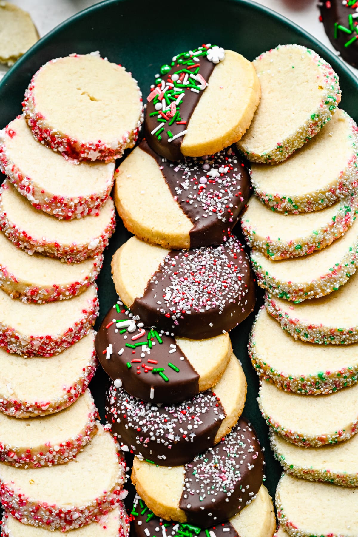 Close up Overhead view of vegan butter cookies on a green platter.