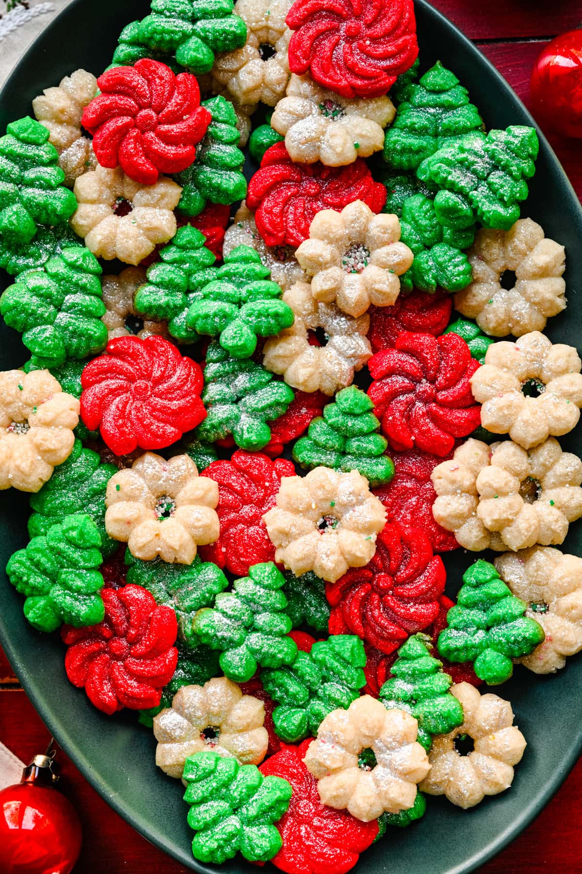 Overhead view of vegan spritz cookies on platter.