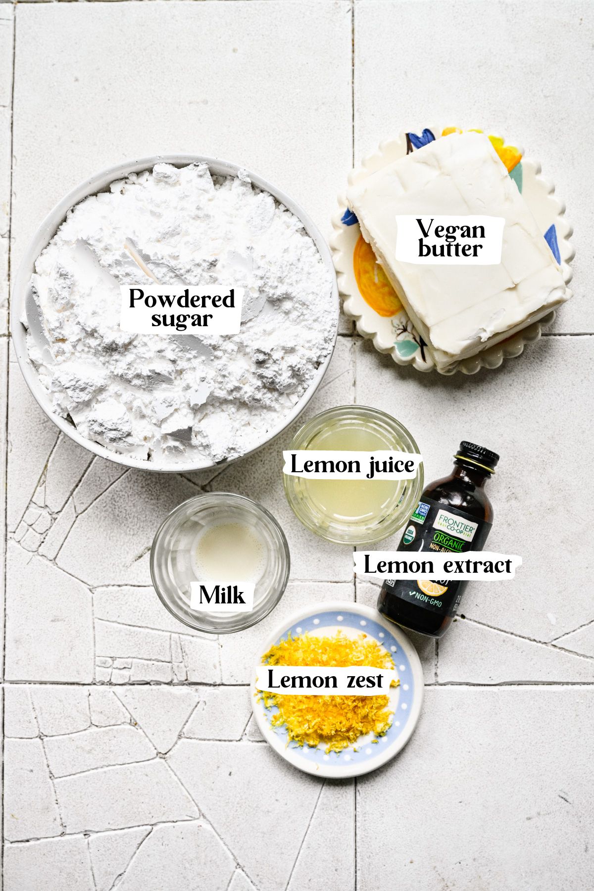 Lemon buttercream ingredients including powdered sugar and lemon zest.