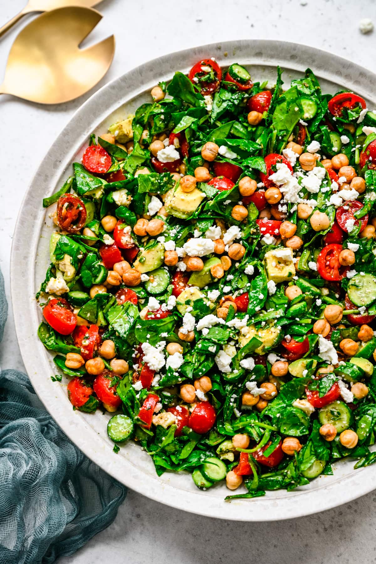 Close up overhead of the finished salad in a large white bowl. 