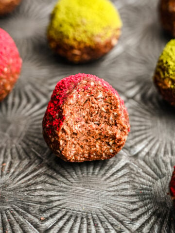 Close up of the interior of the chocolate bliss balls on a silver tray.