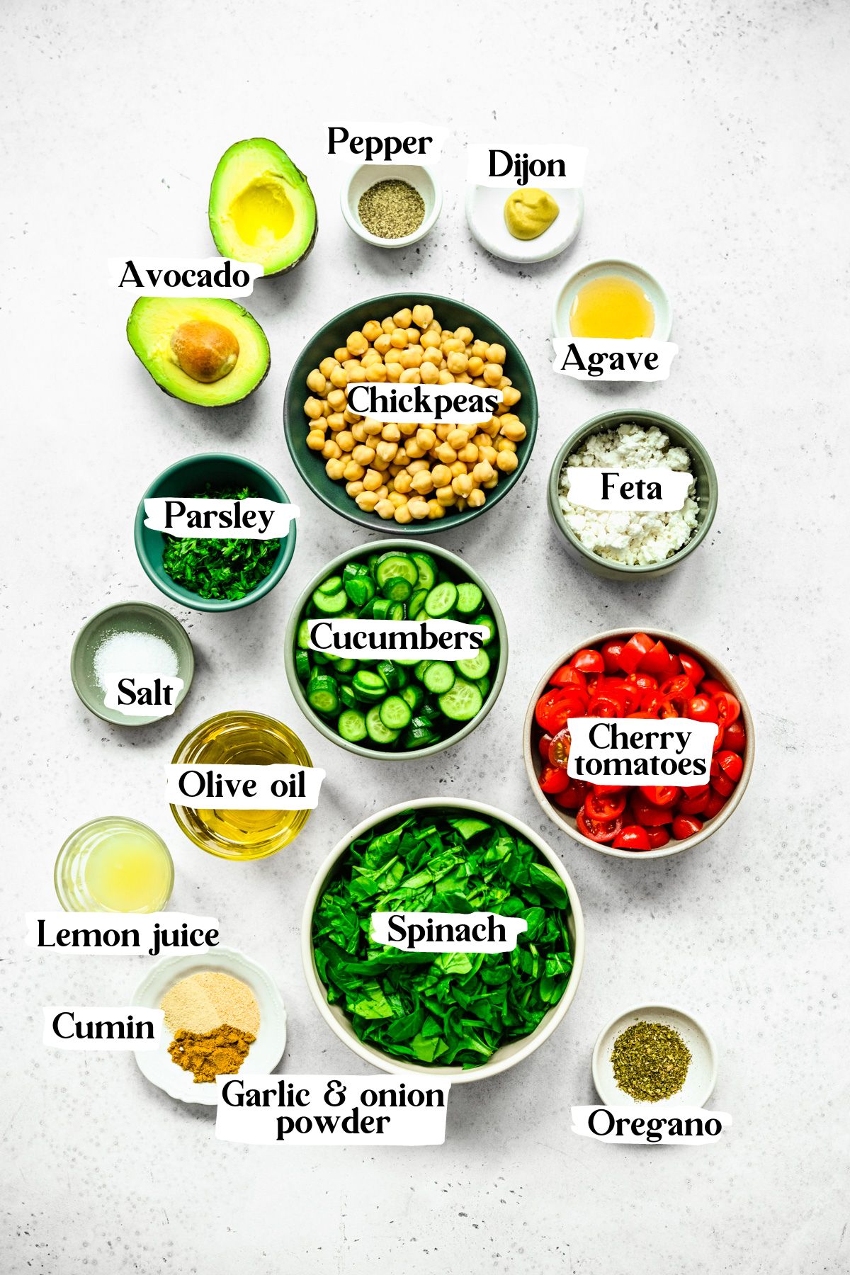 Spinach chickpea salad ingredients including tomatoes and cucumbers.