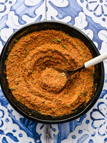 Finished Chermoula spice blend in a black bowl.