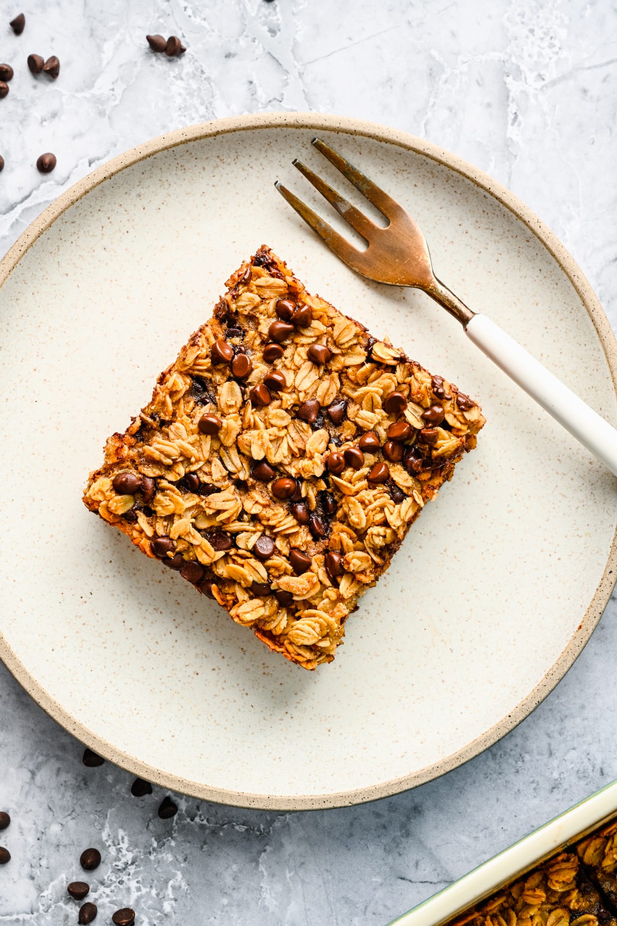 Overhead of a square of the chocolate chip baked oats on a plate.