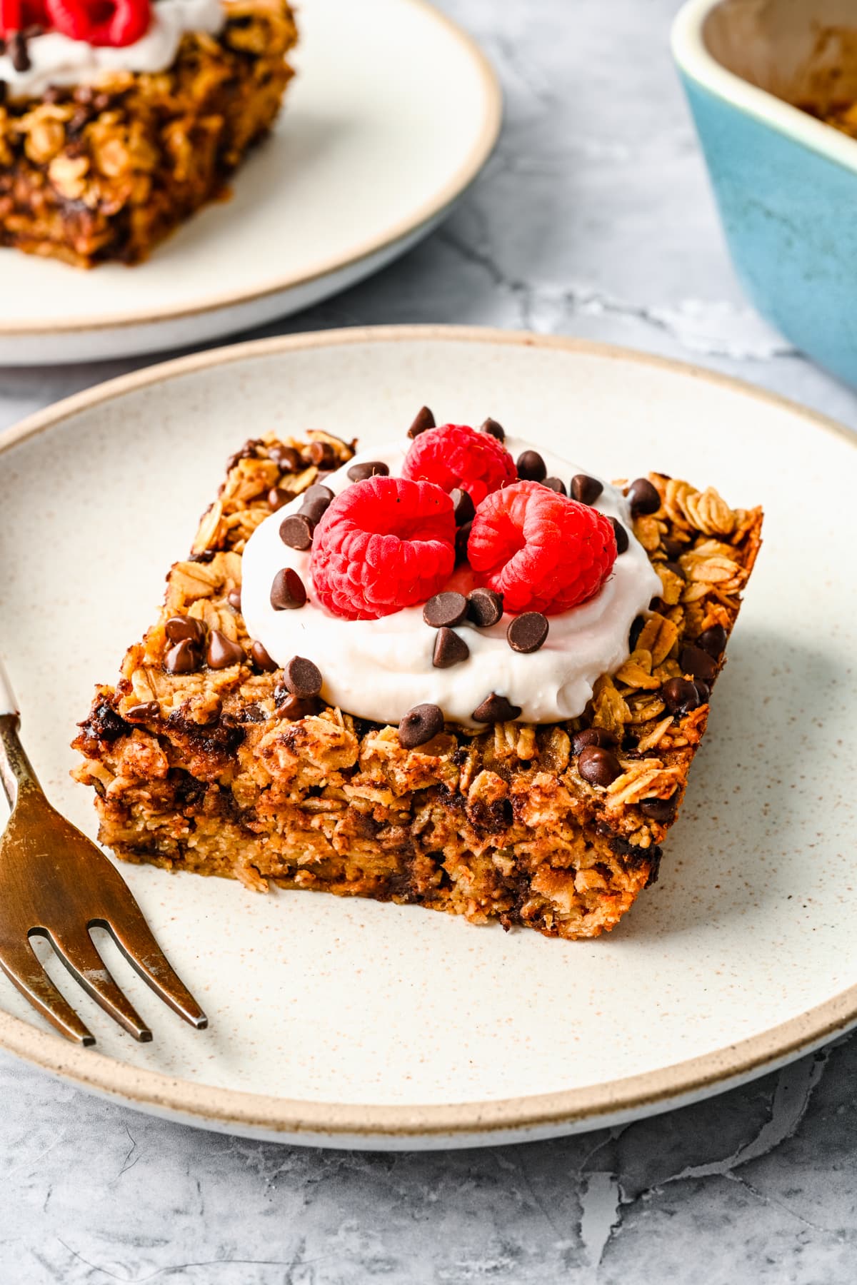 Finished chocolate chip baked oats topped with yogurt and berries.