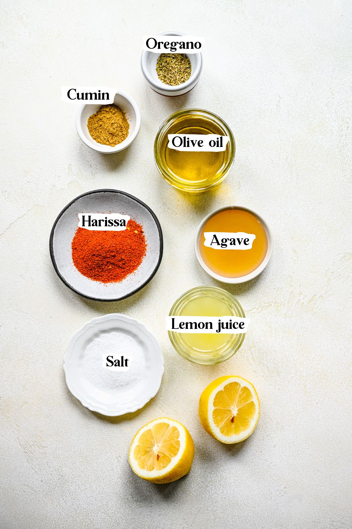 Harissa vinaigrette ingredients including agave and olive oil.