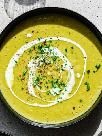 Overhead view of leek and celery soup in a bowl.
