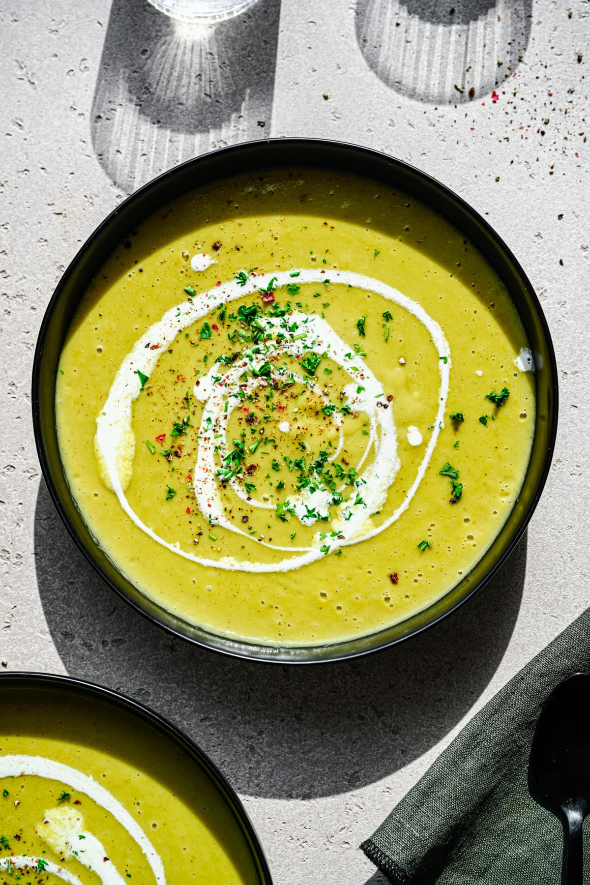 Overhead view of leek and celery soup in a bowl.