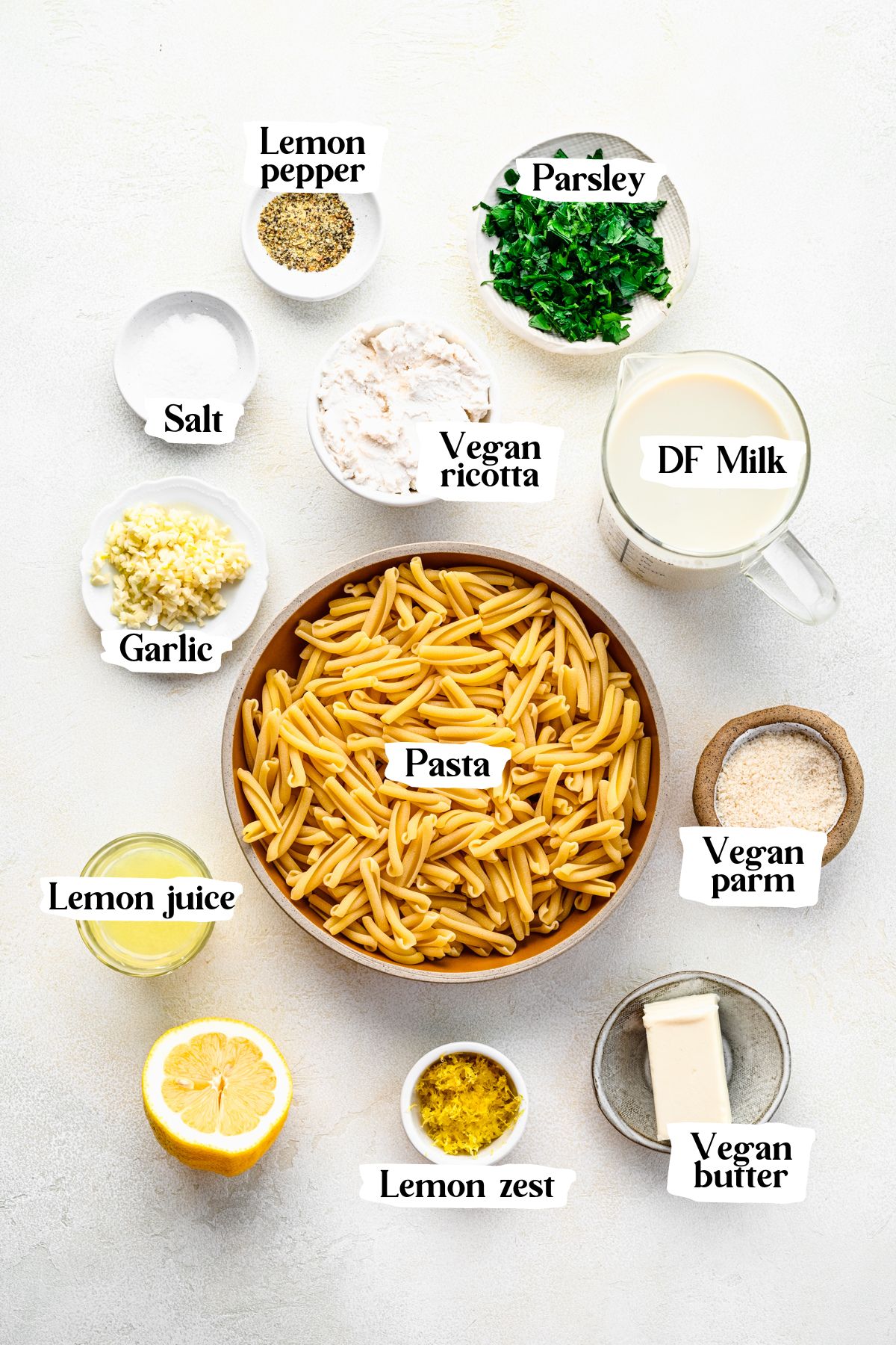 Vegan lemon pasta ingredients including vegan ricotta and lemon juice.