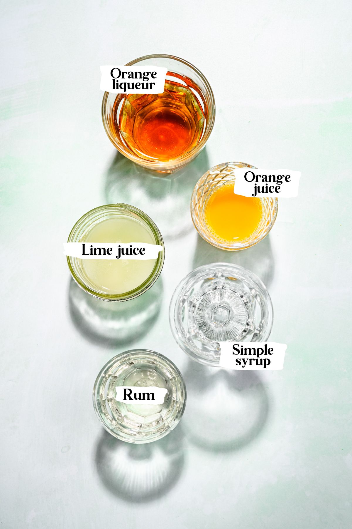 Rum margarita ingredients including orange juice and rum.
