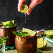Squeezing a lime into the finished mules.