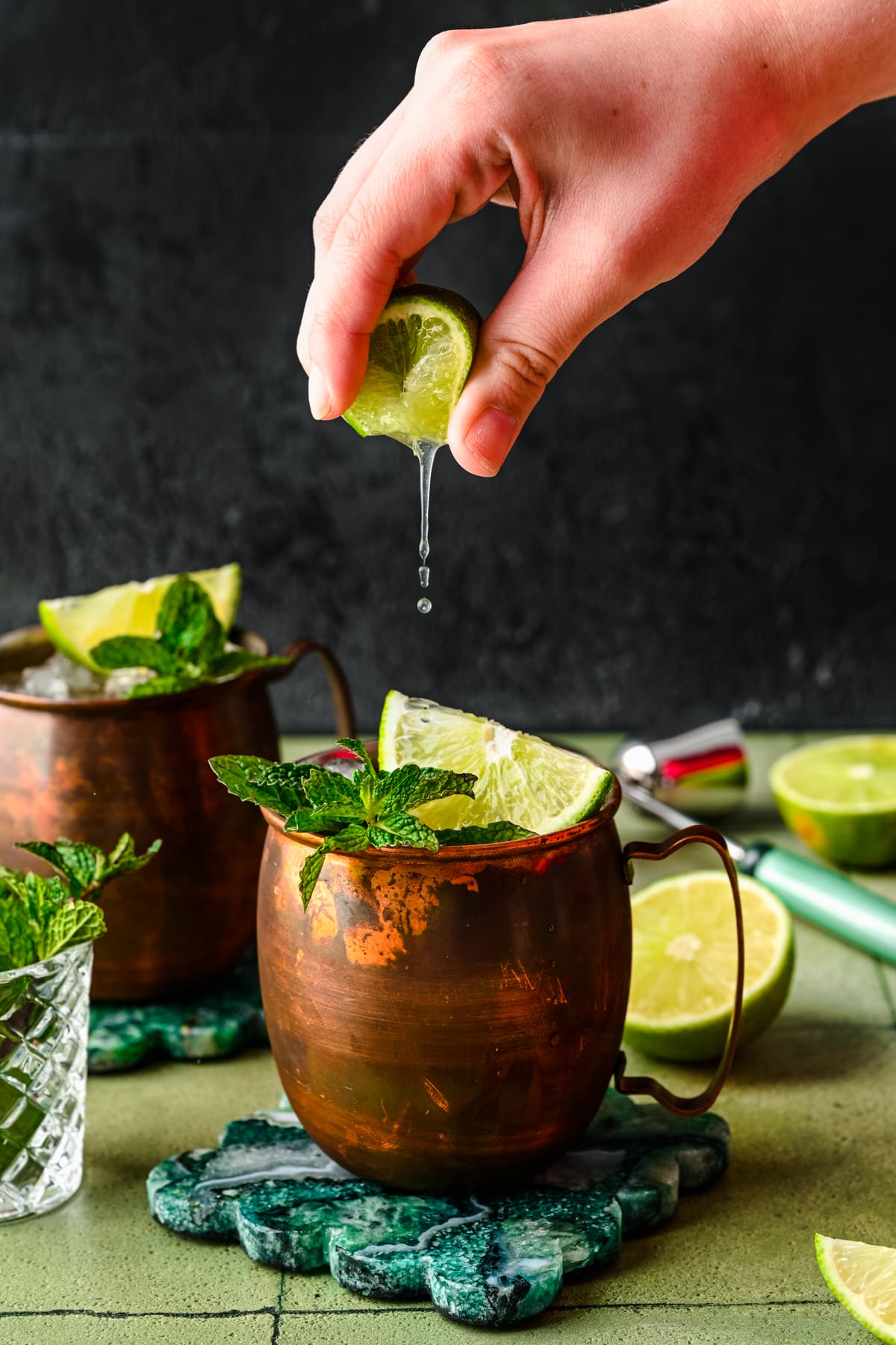 Squeezing a lime into the finished mules.
