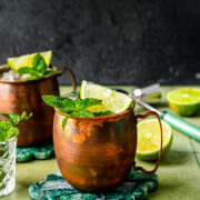 Finished rum Moscow mules with mint and lime garnish in it.