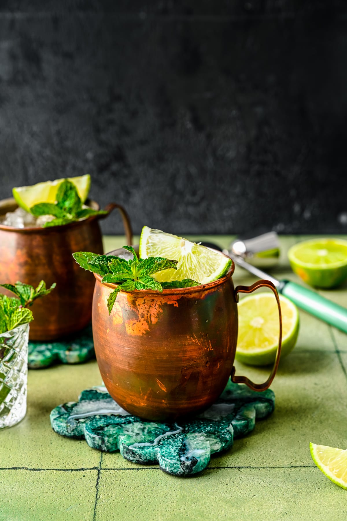 Finished rum Moscow mules with mint and lime garnish in it.