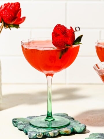 Close up of the finished strawberry martini with a strawberry rose.