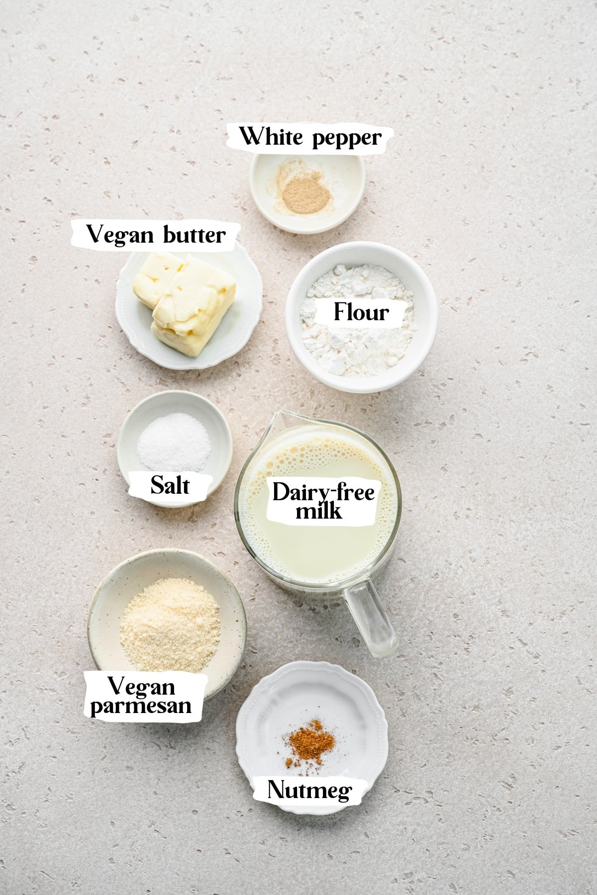 Vegan bechamel ingredients including flour and nutmeg.