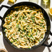 Overhead of the finished vegan lemon pasta in a skillet.