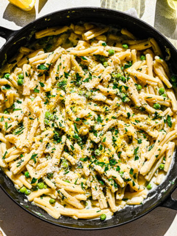 Overhead of the finished vegan lemon pasta in a skillet.