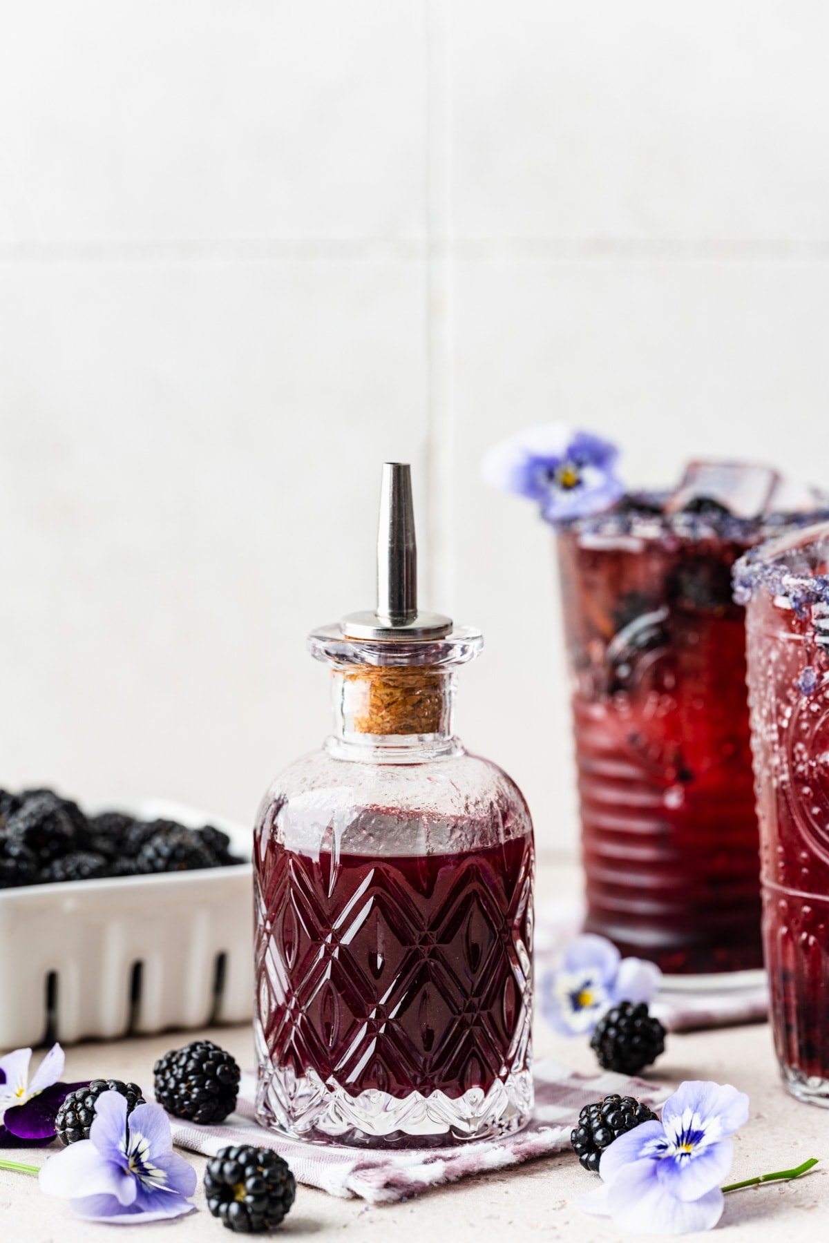 Finished blackberry simple syrup in a glass jar.