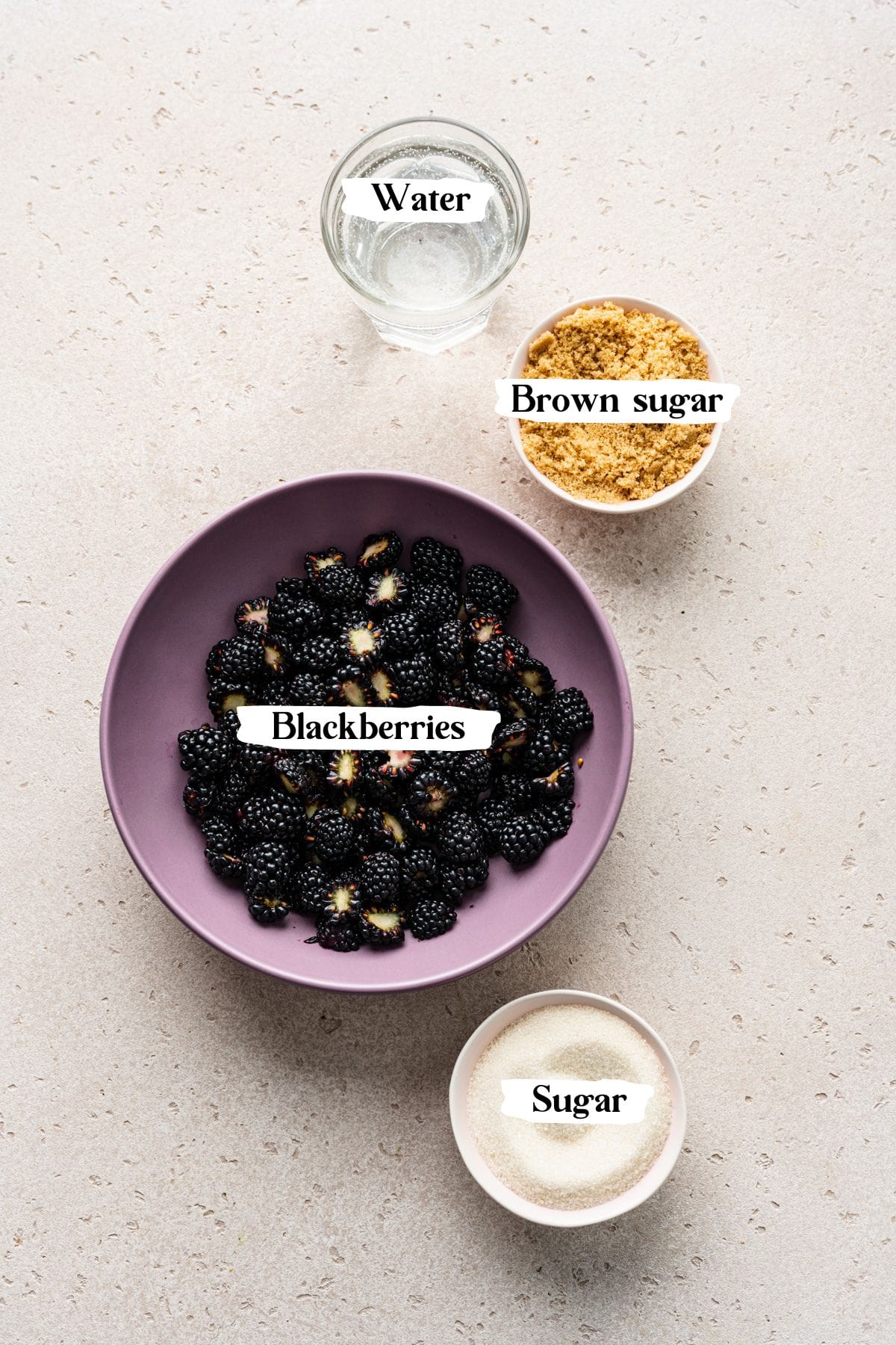 Overhead of the blackberry simple syrup ingredients including sugar and water.