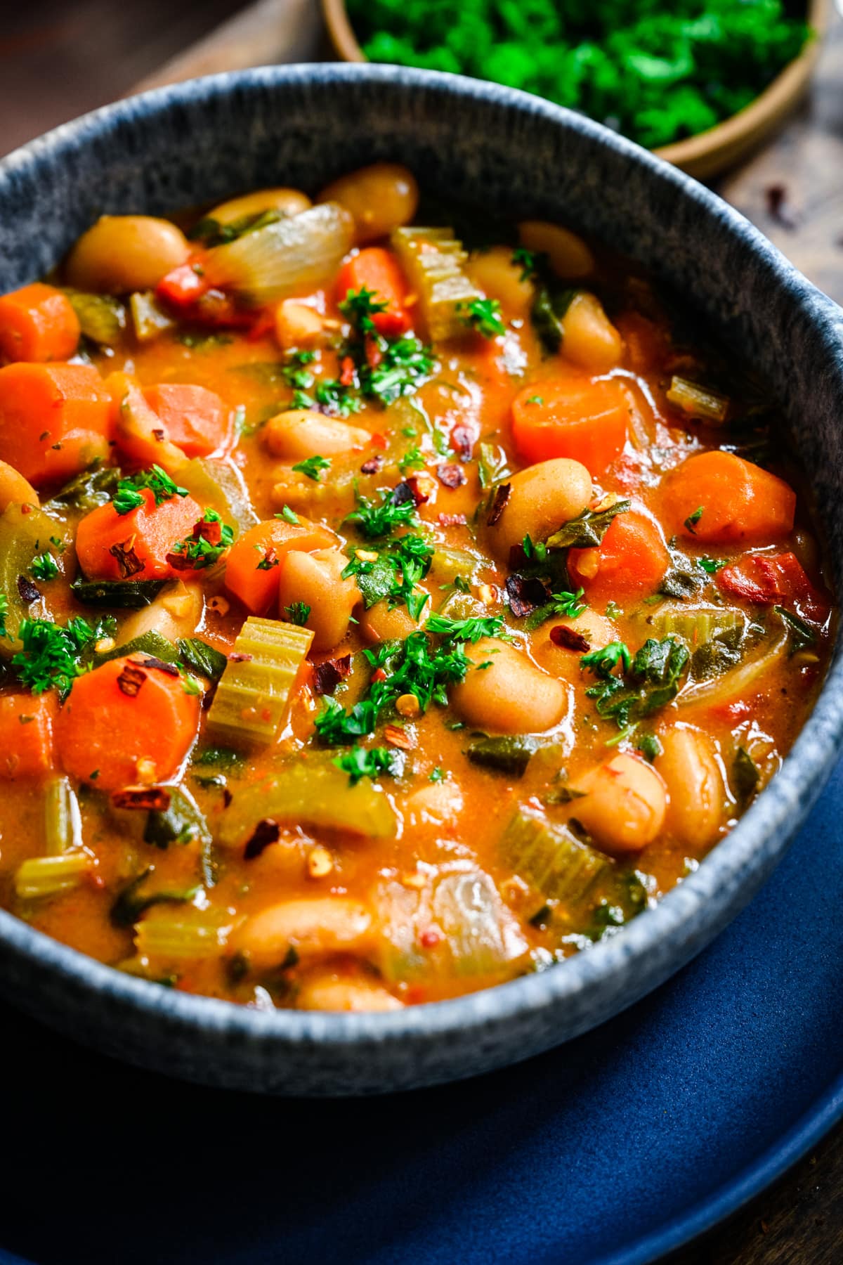 Close up of the finished butter bean stew in a bowl.