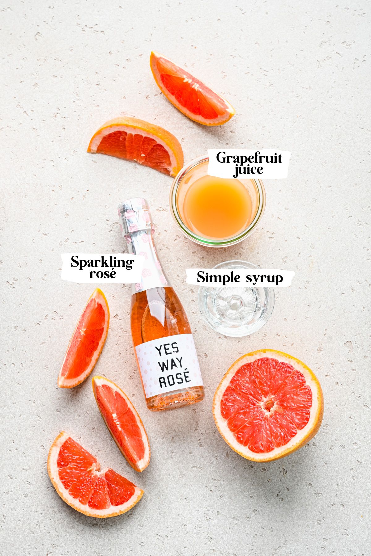 Grapefruit mimosa ingredients including rosé and grapefruit juice.