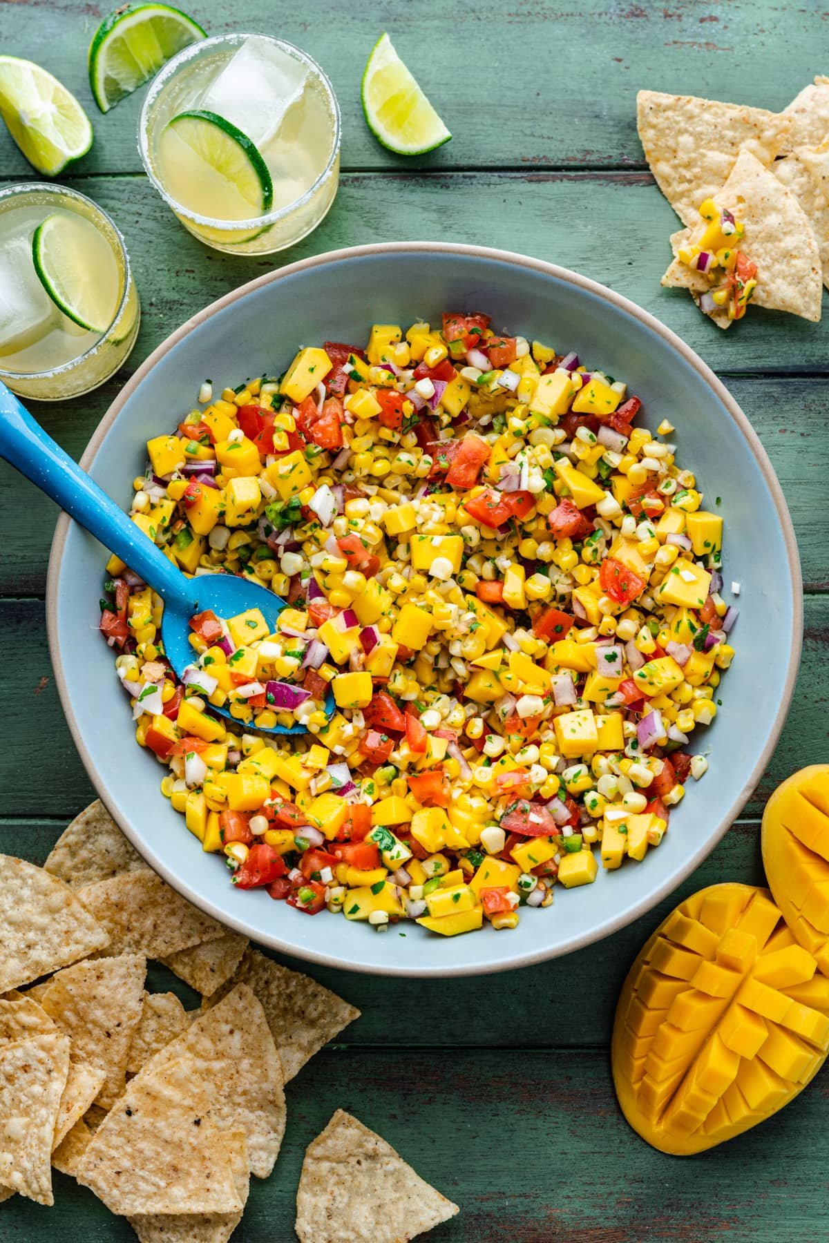 Overhead of the finished mango corn salsa in a blue bowl.