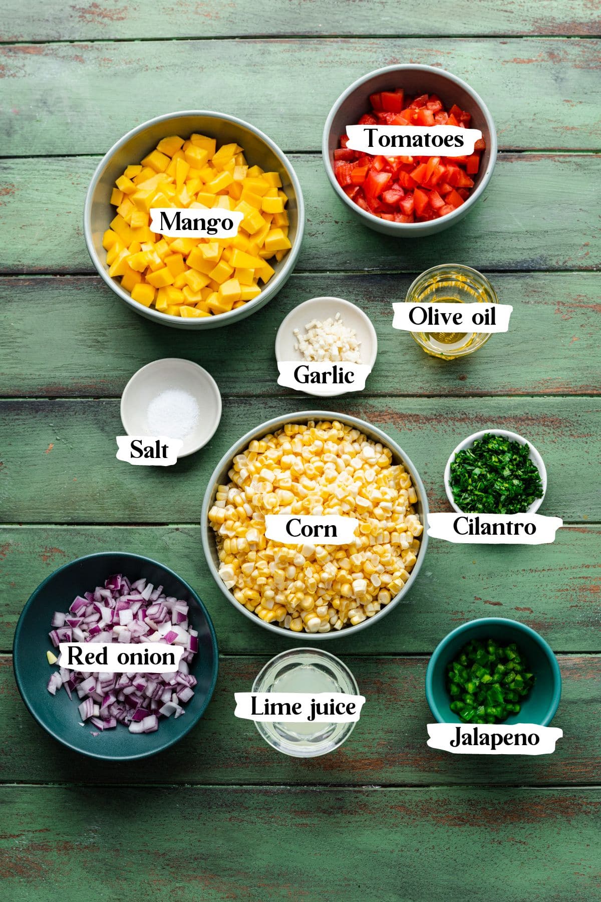 Mango corn salsa ingredients including mango and cilantro.