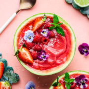 Overhead of the finished watermelon smoothie bowl in a watermelon bowl.