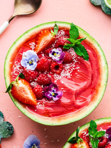 Overhead of the finished watermelon smoothie bowl in a watermelon bowl.