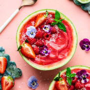 Overhead of the finished watermelon smoothie bowls with lots of toppings.