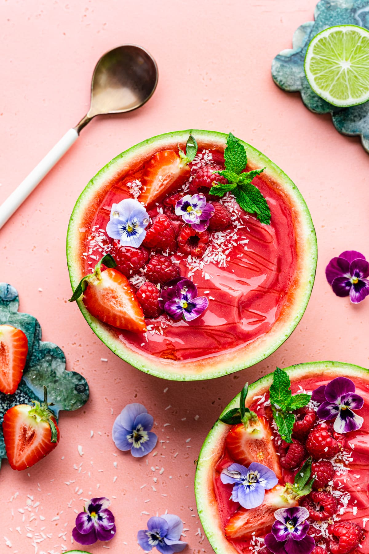 Overhead of the finished watermelon smoothie bowls with lots of toppings.