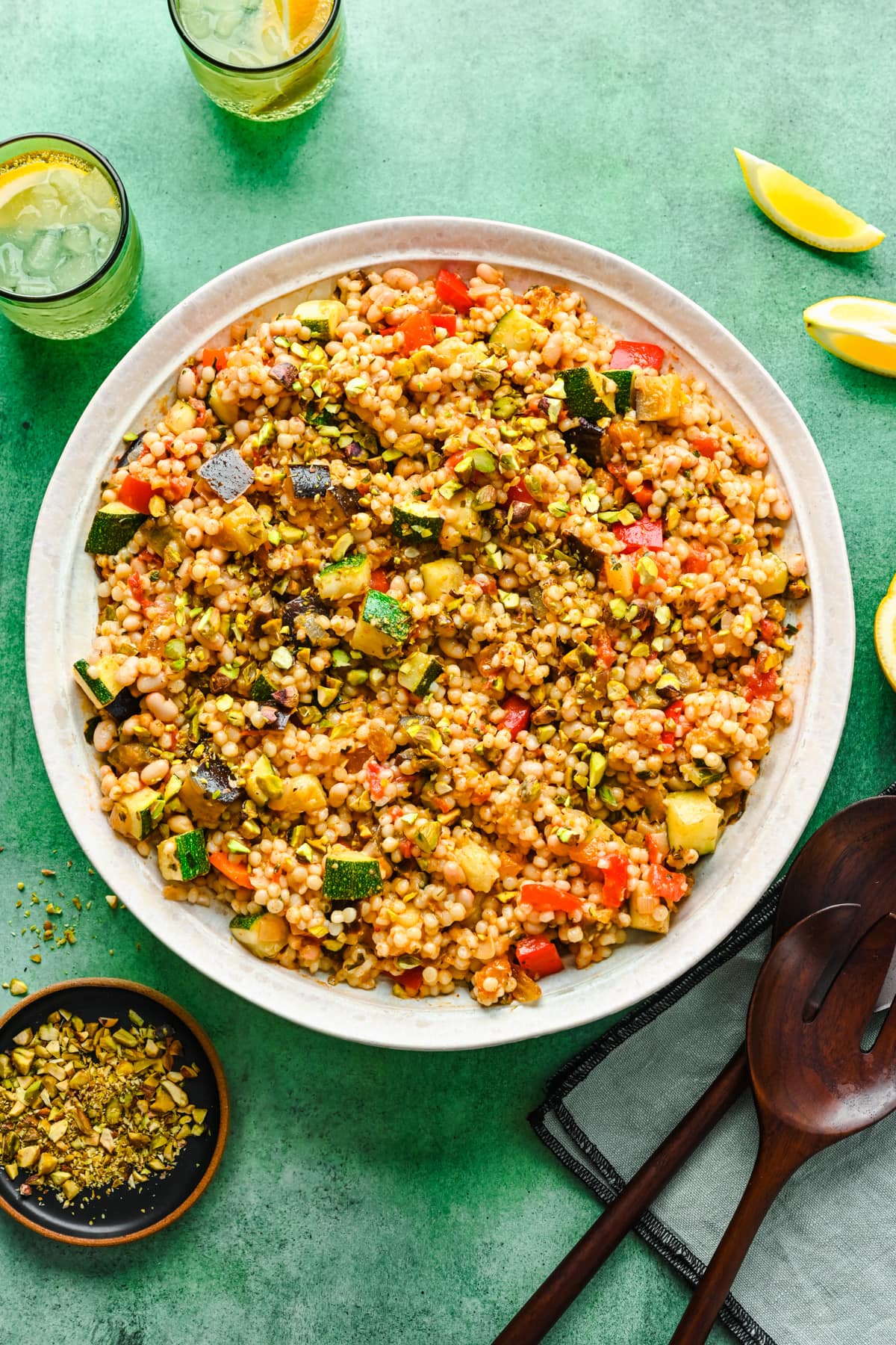 Overhead of the vegan couscous salad in a big white bowl.