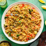 Overhead of the finished vegan couscous salad in a big bowl.