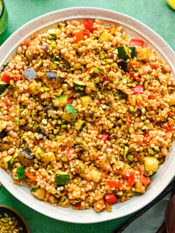 Overhead of the finished vegan couscous salad in a big bowl.