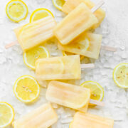 Overhead of the finished lemon popsicles on top of ice.