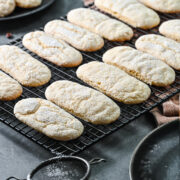 Side view of vegan ladyfingers on a cooling rack.