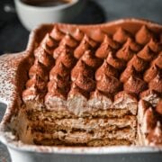 Front view of vegan tiramisu in a baking dish.