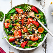 Overhead view of strawberry salad with beet vinaigrette.