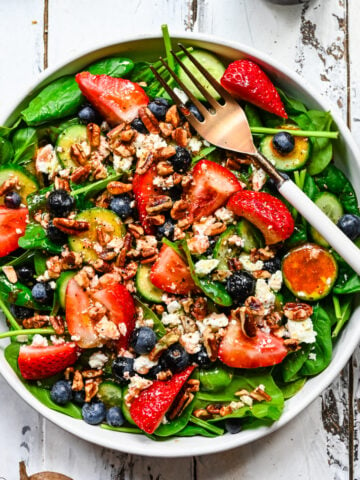 Overhead view of strawberry salad with beet vinaigrette.