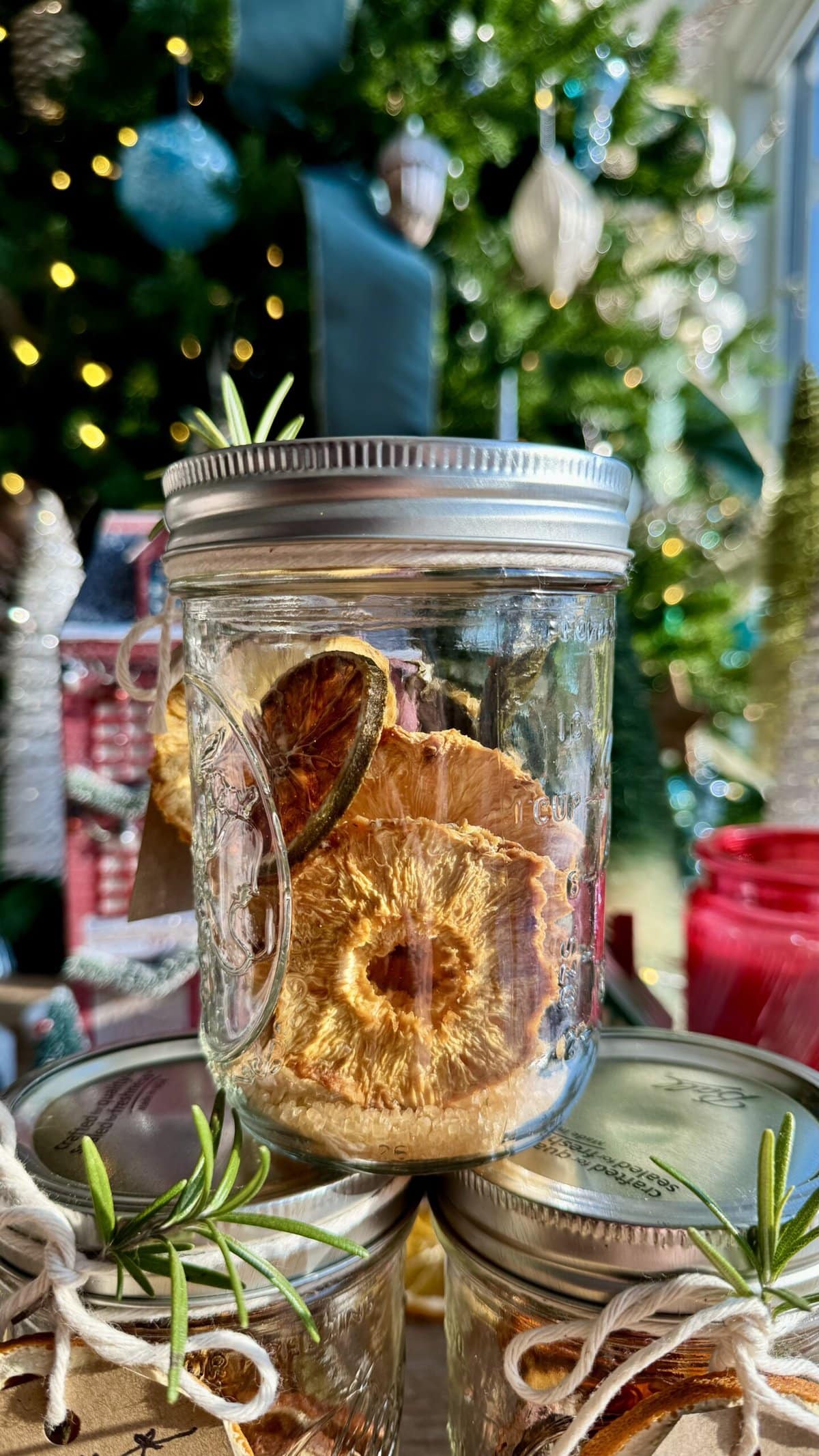 Dried pineapple, jalapeño, limes and sugar in a jar. 