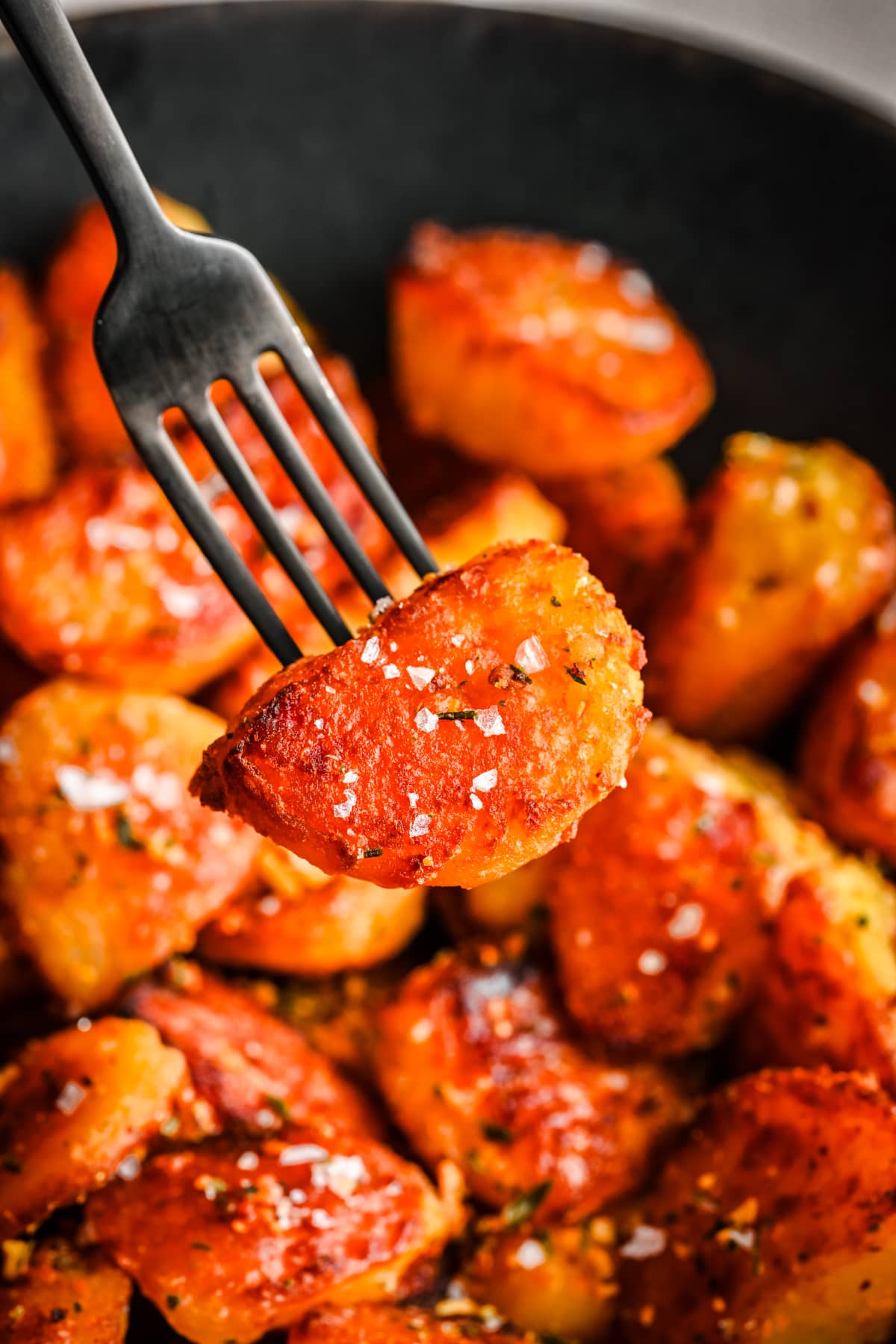 Crispy roast potato on a fork.