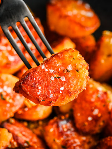 Crispy roast potato on a fork.