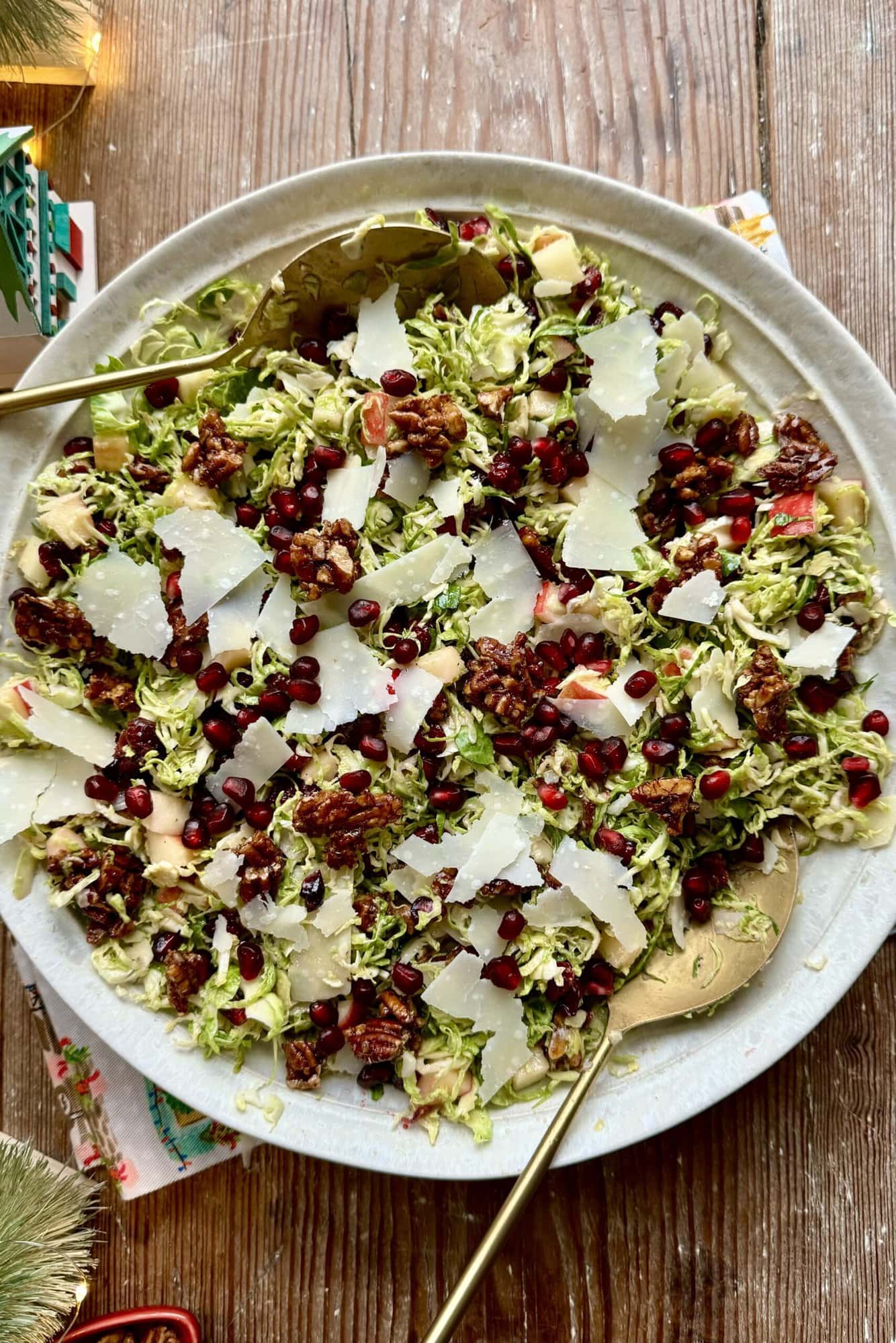 Close up view of shaved brussels sprout salad in a large bowl.