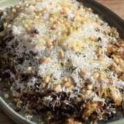 close up view of Roasted shredded brussels sprouts on a platter topped with parmesan.