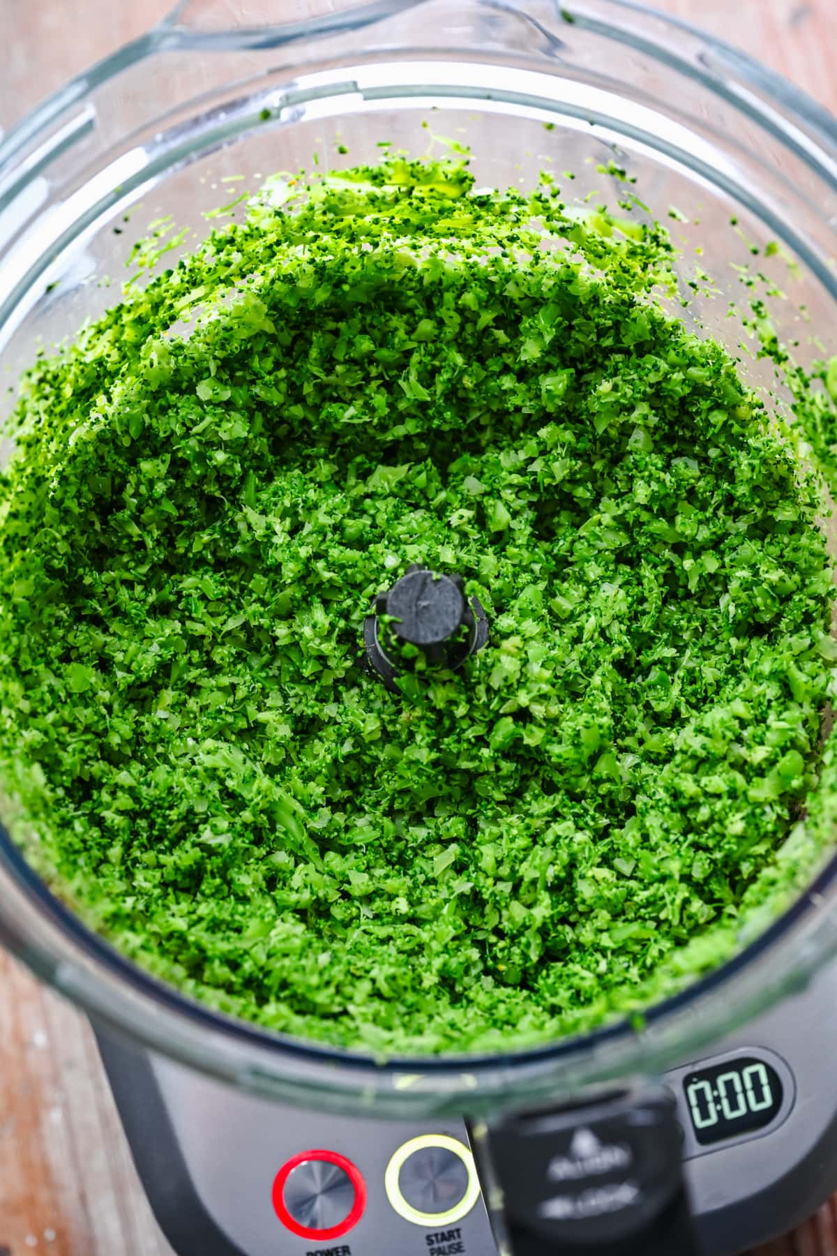 Finely pulse broccoli bits.