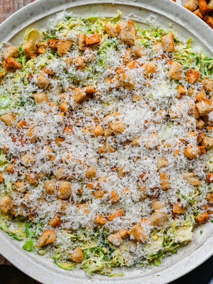 Overhead view of brussels sprouts caesar salad.