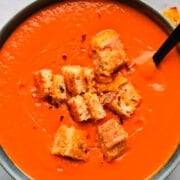 Creamy tomato soup with croutons, served in a bowl. Perfect comfort food, easy to make, and great for a cozy kitchen meal.